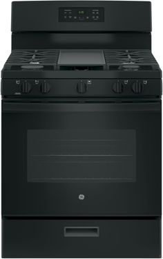 a black stove top oven with the door open and two burners on each side