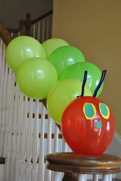 the very hungry caterpillar balloon sculpture is ready to be put into the house