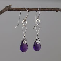 Elegant twist design dangle earrings made of solid sterling silver and faceted amethyst.  They measure approximately 1.75 inches in length.  Our goal is to come up with unique designs that are genuine, timeless, pretty, and comfortable to wear.  We design and makes these earrings right in our small home based business.  These earrings are brand new and made to order.  If you prefer a different color, we have many stone options such as: green onyx, aqua blue sea foam chalcedony, multi colored abalone shell, and so on.  If any of these colors are of interest, we would be happy to create a custom listing for you.  Our jewelry is designed and handmade by Jim and Andrea Lorette of Jayelay (JLA) Jewelers in Westmoreland, NH USA. We just started a newsletter to offer patrons first dibs on unique Teardrop Earrings With A Modern Twist As A Gift, Modern Twist Teardrop Earrings Gift, Silver Earrings Drop, Spiral Earrings, Earrings Drop, Amethyst Earrings, Green Onyx, Abalone Shell, Home Based Business