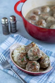 meatballs and mashed potatoes in a red bowl