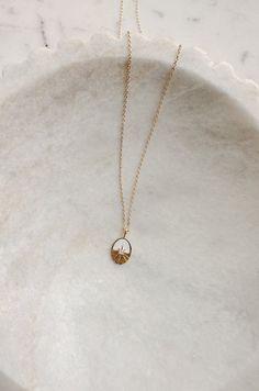 This 18k Gold Oval Sun Pendant Necklace is a beautiful and timeless accessory. The pendant is crafted from 18k gold plated metal, while the claw clasp ensures it will fit comfortably. 18k gold dipped oval pendant clasp closure Curvy Date Night Outfit, Dress With Embroidered Flowers, Gauzy Dress, Cotton Gauze Dress, Valentines Day Dresses, Cream Puff, Sun Pendant, Mini Accessories, Balloon Sleeve Dress