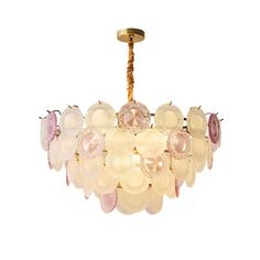 a chandelier with pink and white glass balls hanging from it's center