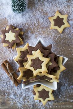 some cookies and cinnamon sticks on a table