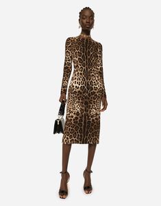 Leopard-print cady dress with long sleeves: Round neck Long sleeves Leopard-print stretch satin lining Rear zipper and hook-and-eye fastening The piece measures 114 cm from the rear seam on a size IT 40 The model is 175 cm tall and wears a size IT 40 Made in Italy Animal Print Cocktail Dresses, Wide Leg Jeans Cropped, Straight Leg Jeans Men, Long Cocktail Dress, Long Sleeve Cocktail Dress, Dolce Gabbana Dress, Fur Coats Women, Women Long Sleeve Dress, Dress With Long Sleeves