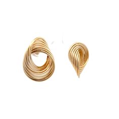 These stud earrings in 14 karat yellow gold feature interlocked circles creating a unique swirl pattern that is both geometric and fluid. The polished gold finish adds a radiant glow, making these earrings suitable for any occasion. Lightweight and comfortable, they are ideal for all-day wear. Their distinctive design blends modern style with classic appeal, making them a standout piece in any jewelry collection. Whether for a special night out or everyday wear, these swirl earrings offer elegance and individuality. Modern Twist Yellow Gold Earrings With Polished Finish, Modern Twist Polished Yellow Gold Earrings, Modern Twist 14k Gold Earrings, Modern Twist 14k Gold Earrings For Formal Occasions, Modern Twist 14k Gold Formal Earrings, Elegant Spiral Gold Plated Earrings, Modern Twist 14k Yellow Gold Earrings, Gold-plated Yellow Gold Spiral Earrings, Gold Plated Spiral Earrings In Yellow Gold