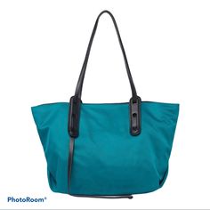 A Water Resistant Nylon Tote Bag Is The Perfect- Pick For On- The Style. Dual Shoulder Straps Top Magnetic Closure Water - Resistant Nylon Exterior Lined Interior Features Zip Wall Pocket And Lobster Clasp For Keychain Approx 10 1/2h X 14”W X 8”D Approx 10 1/2 Handle Drop Material: Textile Exterior And Lining Msrp: $190 Casual Nylon Bags With Leather Handles, Blue Nylon Shoulder Bag With Double Handle, Green Nylon Shoulder Bag With Double Handle, Blue Nylon Shoulder Bag, Nylon Shopping Bags With Handles, Nylon Shoulder Bag With Leather Handles, Nylon Shoulder Bag With Leather Handles For Daily Use, Nylon Tote Bag For Errands, Nylon Bags With Handles For Daily Use