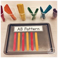 an assortment of different colored toothbrushes on a tray with the word ab pattern