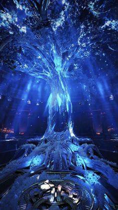 an artistic photo of a tree with blue lights and snow on it's branches