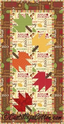 an autumn quilt with arrows and words on the front, in red, green, yellow and orange