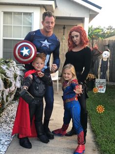 the family is dressed up as captain america and spider - man