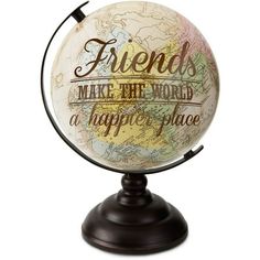 a globe with the words friends make the world a happy place on it's stand