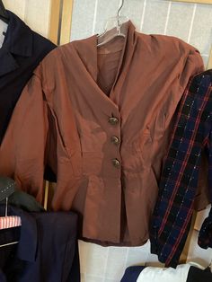 "Lot of 1940's and 1950's ladies blazers. 6 in total. Overall good vintage contain, but some have imperfections 1. Red black and blue plaid wool blazer with spots of white. 34/35\" bust, 30\" waist, shoulder to hem is 21\". Many moth holes, largest is in the left shoulder 2. Olive green cropped pullover top with white yarns and half sleeves. 38\"bust, shoulder to hem 18\" 3. 1940's light brown blazer with delicate gold buttons. Slightly reflective material. 42/44\" bust, 34\" waist, 22\" shoulde Fall Vintage Fashion Single-breasted Outerwear, Vintage Double-breasted Blazer With Button Closure, Vintage Tailored Outerwear For Work, Tailored Vintage Outerwear For Work, Vintage Single Breasted Blazer For Fall, Winter Vintage Blazer With Lapel Collar, Vintage Button-up Blazer For Work, Vintage Workwear Blazer With Buttons, Vintage Blazer With Buttons For Workwear