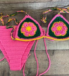 Handmade crochet colorful flower bikini set Triangle Bikini top and Bikini bottom. Washing machine wash  Do not put in dryer Sizes for Bikini Top and Bottom: S - L Bikini Bottom Colors: Pink, yellow, and green. Message me if you have any questions! I am happy to answer! Handmade Pink Swimwear For The Beach, Handmade Pink Swimwear For Vacation, Handmade Fitted Swimwear For Beach Party, Handmade Fitted Pink Swimwear, Handmade Green Swimwear For Vacation, Handmade Multicolor Swimwear For Beach, Handmade Multicolor Swimwear For Vacation, Handmade Multicolor Beach Swimwear, Handmade Green Swimwear For The Beach