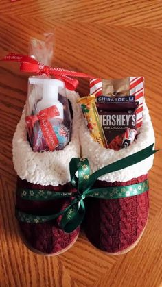 a pair of red and white slippers sitting on top of a wooden table next to a bag