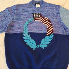 Vintage Gianni Versace Sweater In Pristine Condition. Unisex, Size Iv/ 50. Made In Italy With A Blend Of 75% Lambswool, 10% Cashmere, 10% Silk, 5% Angorawool. Crew Neckline, Embroidered American Flag. Beautiful Hand. Measures 21" From Pit To Pit And 25" From Back Collar Seam To Hem. Blue Fitted Wool Sweater, Fitted Blue Wool Sweater, Blue Knitted Wool Tops, Retro Blue Knit Sweater, Blue Retro Knit Sweater, Blue Wool Knit Sweater, Versace Sweater, Sweaters Vintage, Versace Blue