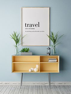 there is a plant on top of a shelf in front of a blue wall with a quote above it