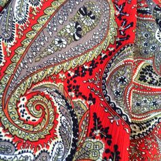 an image of a red and black paisley print fabric