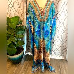 Brand New With Tags True Colours By La Moda One Size Jungle Blue Maxi Swim Cover-Up. Has Jeweled Embellishments, And Tassels, And Has A Front Lace Up Style. See Photos For Up Close Details! Brand New With Tags! Retails For $128 Gorgeous Caftan Cover Up. Hand Wash One Size. Measurements Are: Bust: 52 Waist: 50 Hips: 55 Blue Boho Print Kaftan For Beach Season, Blue Boho Print Kaftan For Vacation, Blue Embellished Maxi Dress For Summer, Blue Long Kaftan With Boho Print, Bohemian Light Blue Beach Kaftan, Bohemian Light Blue Kaftan For Beach, Blue Boho Print Maxi Kaftan, Beach Long Sleeve Embellished Kaftan, Long Sleeve Embellished Kaftan For Beach