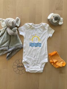 Seas the moment with this adorable summer vibes Onesie®! Our adorably decorated baby bodysuits are perfect for your baby's social life from lounging at home, visiting grandparents or cruising in the neighborhood or park.  The design on the bodysuit is handmade with care and attention to detail. We use Gerber® brand onesies which are incredibly soft and made from 100% cotton. We recommend ordering one size larger.  Your bodysuit arrives beautifully packaged and is the perfect baby shower or new-b Visiting Grandparents, Summer Onesies, Gift Photo, Ocean Vibes, Perfect Baby Shower, Beach Lover, Gender Neutral Baby Clothes, Welcome Gifts, Beach Lovers