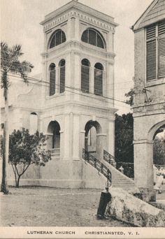 an old black and white photo of a church with stairs leading up to the steeple