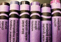 six purple crayons are lined up in a row