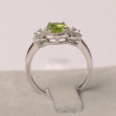 ~~~~~~~~~~~~~~~~Ring details~~~~~~~~~~~~~~~~metal: silver/14k white(rose/yellow) goldcenter stone: oval shape 6*8 mm (1.64 ct) peridotaccent stone: czNOTE: if it is silver or white gold, it will be get plated with rhodium~~~~~~~~~~~~~~~~Customization is available~~~~~~~~~~~~~~~~you can change, add or remove any parts of the ring if you have good idea. I can add special engraving inside the shank of the ring by free (words, date, simply simbles and so on) too. I am happy to help out or make any a Peridot Birthstone Ring In White Gold, Elegant Peridot Birthstone Ring With Prong Setting, Elegant Lime Green Ring With Center Stone, Peridot Diamond Ring For May Birthstone, Anniversary Birthstone Ring With Peridot Center Stone, Anniversary Peridot Birthstone Ring With Center Stone, Silver Birthstone Ring With Peridot And Accent Stones, Fine Jewelry Peridot Birthstone Ring With Center Stone, Silver Peridot Birthstone Ring With Accent Stones