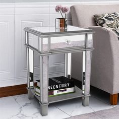 a silver end table with a book on it