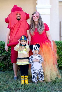 a family dressed up in costumes for halloween