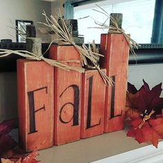 two wooden blocks with the word fall written on them