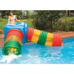 a woman is playing in an inflatable pool