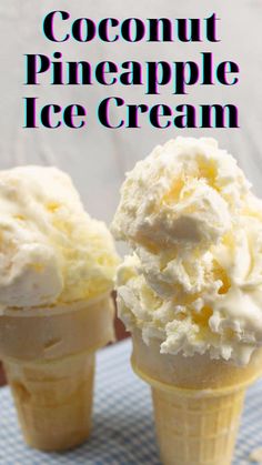 two ice cream cones sitting on top of a table