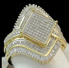 two tone gold and white diamond ring set on top of a mannequin head