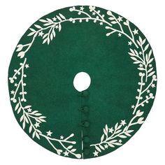 a green and white christmas tree skirt