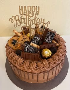 a birthday cake with chocolate and cookies on top