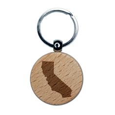 a wooden keychain with the shape of california on it's front and back