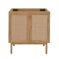 a wooden cabinet with wicker doors and two black knobs on the front door