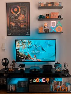 a flat screen tv sitting on top of a black entertainment center next to shelves filled with toys