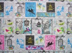 a quilt with birds and birdcages on it