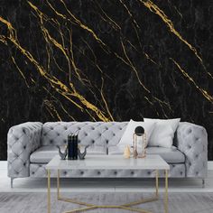 a living room with black and gold marble wallpaper