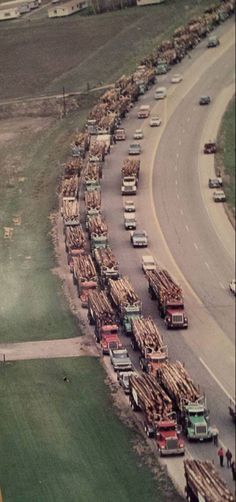 an aerial view of trucks and cars on a highway