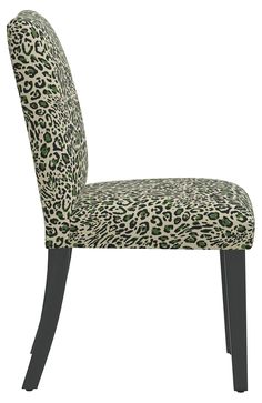 a leopard print upholstered chair with black legs