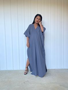 Embrace the gentle waves and sunny shores with our double gauze cotton kaftan. This versatile caftan falls gracefully between the knees or ankles, depending on the length you choose. It's the ultimate in loungewear for women - perfect as a beach dress or cover up. Crafted from light and airy double gauze cotton, it's your essential for a night on the town, a day by the sea, or just running errands. Spring Kaftan With Kimono Sleeves And Relaxed Fit, Oversized Kaftan For Spring Loungewear, Relaxed Fit Kaftan For Loungewear In Spring, Summer Lounging Dress With Relaxed Fit, Casual V-neck Relaxed Fit Kaftan, Relaxed Fit Summer Dress For Lounging, Relaxed Fit Summer Lounging Dress, Spring Maxi Tunic With Relaxed Fit, Spring Maxi Length Relaxed Fit Kaftan