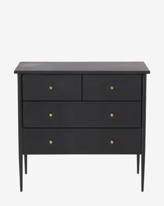 a black dresser with three drawers and two gold knobs on the bottom, against a white background