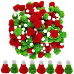 a bunch of knitted christmas decorations sitting next to each other