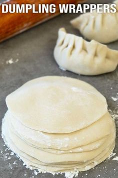 dumpling wrappers are stacked on top of each other in preparation to be baked