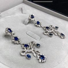 ENJOY OUR WORRY-FREE SERVICE AND THE DAZZLING, GENUINE JEWELRY WE DESIGN AND HANDCRAFT WITH LOVE❤️ ABOUT THE ITEM: A true MASTERPIECE, CHANDELIER EARRINGS, FEATURING 12 PIECES OF TOP GRADE, VIVID BLUE, FULLY TRANSPARENT, SIAMESE BLUE SAPPHIRES, weighting a total of 10.42 carats & over 232 pieces of E/VS DIAMONDS. With total diamonds weight at a WHOOPING 2.61 carats!! Set in ONE OF A KIND 18K SOLID WHITE GOLD, ENORMOUS CHANDELIER EARRINGS! (18 grams of gold weight) WORLD-CLASS MASTERPIECE NOW Luxury Oval Sapphire Diamond Earrings, Luxury Platinum Blue Earrings, Luxury Blue Platinum Earrings, Luxury Sapphire Diamond Earrings, Luxury Blue Diamond Drop Earrings, Luxury Blue Diamond Earrings With Accents, Luxury Sapphire Earrings, Elegant Blue Platinum Earrings, Blue Platinum Earrings For Wedding