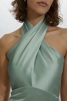 Asymmetric crisscross halter curved empire gown. Shown in Sage. It is possible to have this style Made to Order in any of our standard Fluid Satin colors, please reach out to customerservice@amsale.com to place an order. Cross Over Halter Neck Dress, Halter Neck Evening Dress, Bridesmaid Dress Halter Neck, Halter Formal Dresses, Cross Neck Dress Neckline, Crossed Neck Dress, Dresses For Small Chested Women, Cross Halter Satin Dress, Chic Satin Halter Neck Gown