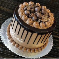 a cake with chocolate frosting and decorations on top