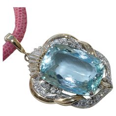 Pendant with very fine aquamarine in a rectangle cut of 24.50 ct, AAA+, 22 x 15.5 mm, eye-clean (in the picture you can mistakenly see reflections that look like inclusions), lavishly decorated with full-cut brilliant-cut diamonds and diamond baguettes totaling approx. 0.83 ct TW (fine white G) / VS-SI (very small - small inclusions), in rhodium-plated settings, translucent made of 750 yellow gold, with large clip loop (4.8 x 5.5 mm), approx. 44x 27.5 x 10.5 mm, weighs approx. 15.9 grams, large Lucky Stone, A Rectangle, Aqua Marine, Happy Marriage, Baguette Diamond, Intense Colors, Brilliant Cut Diamond, Rhodium Plated, Aquamarine