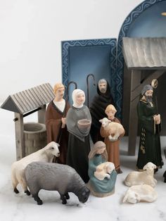 a nativity scene with figurines of people and animals